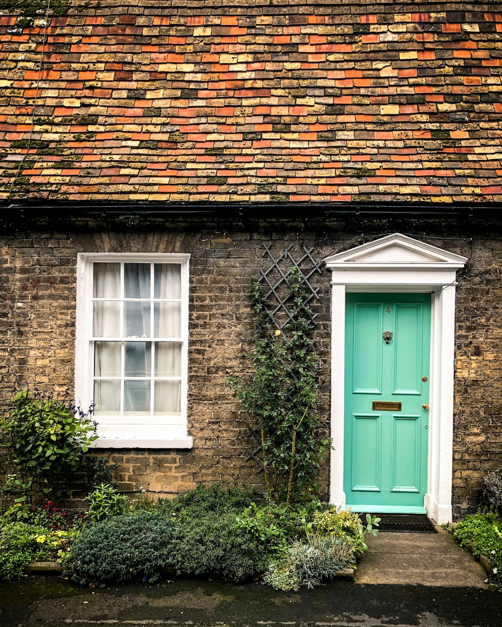white window and green door