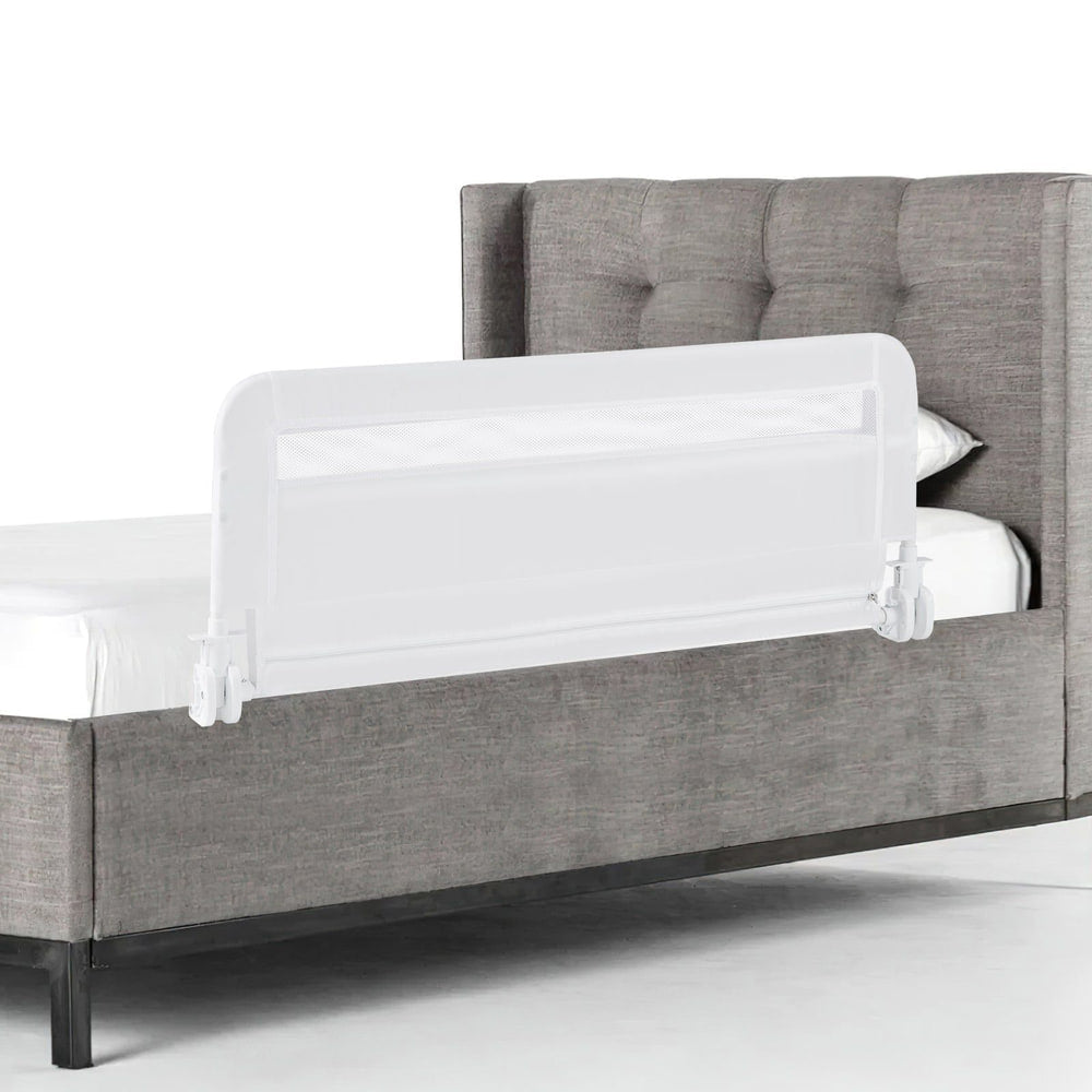 100 CM/120 CM Foldable Baby Bed Rail attached to the side of a grey upholstered bed frame