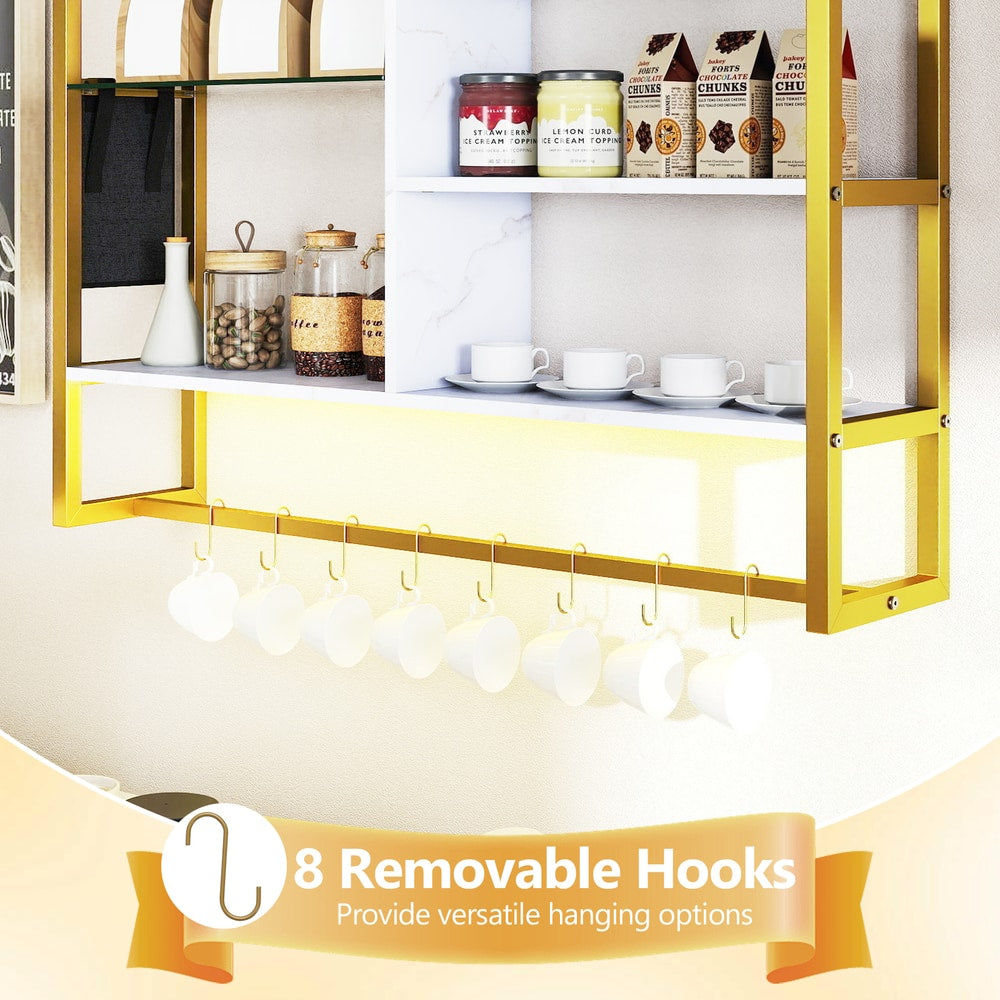 Close up of the white floating shelves showing eight removable hooks for cups