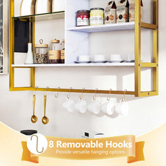 Close up of the white and gold bookcase showing the eight removable S-hooks holding spoons and cups