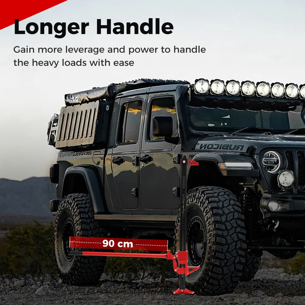 Farm jack with a longer handle shown next to a large vehicle