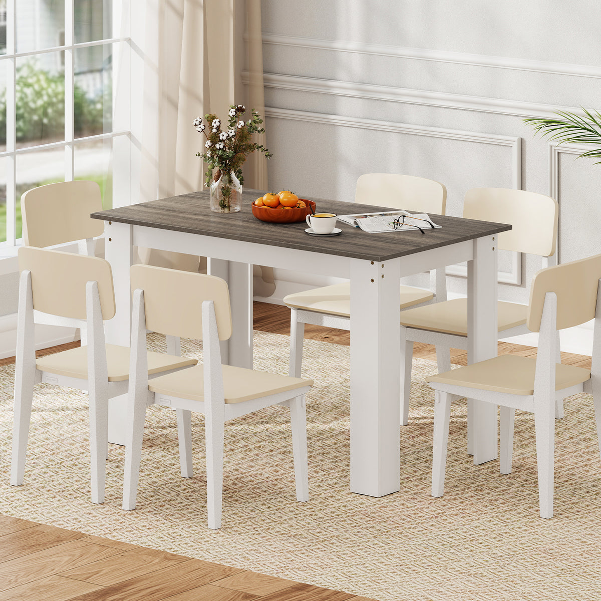 The dining table with six chairs around it in a room setting