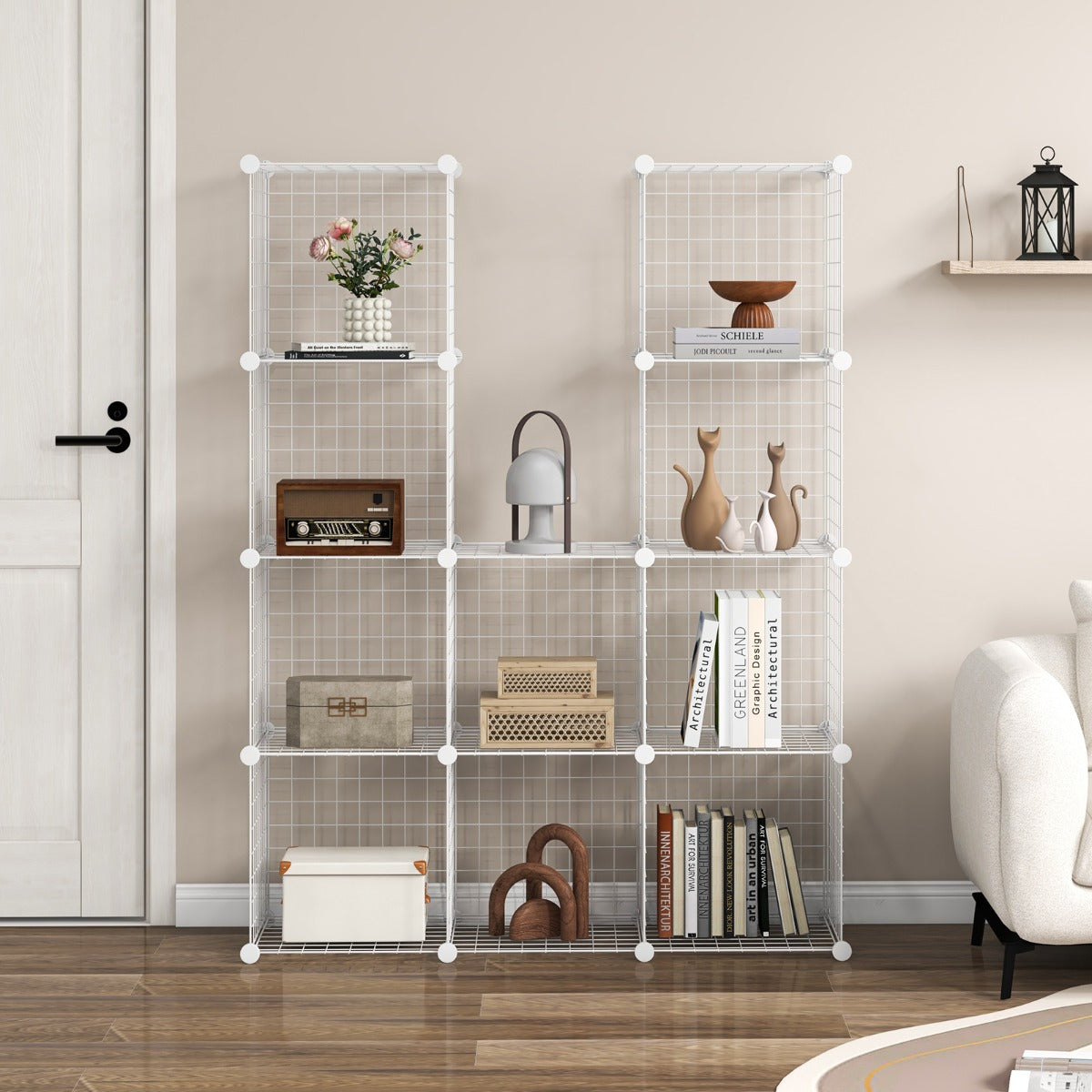 Two white wire cube storage units side by side, styled with books and ornaments