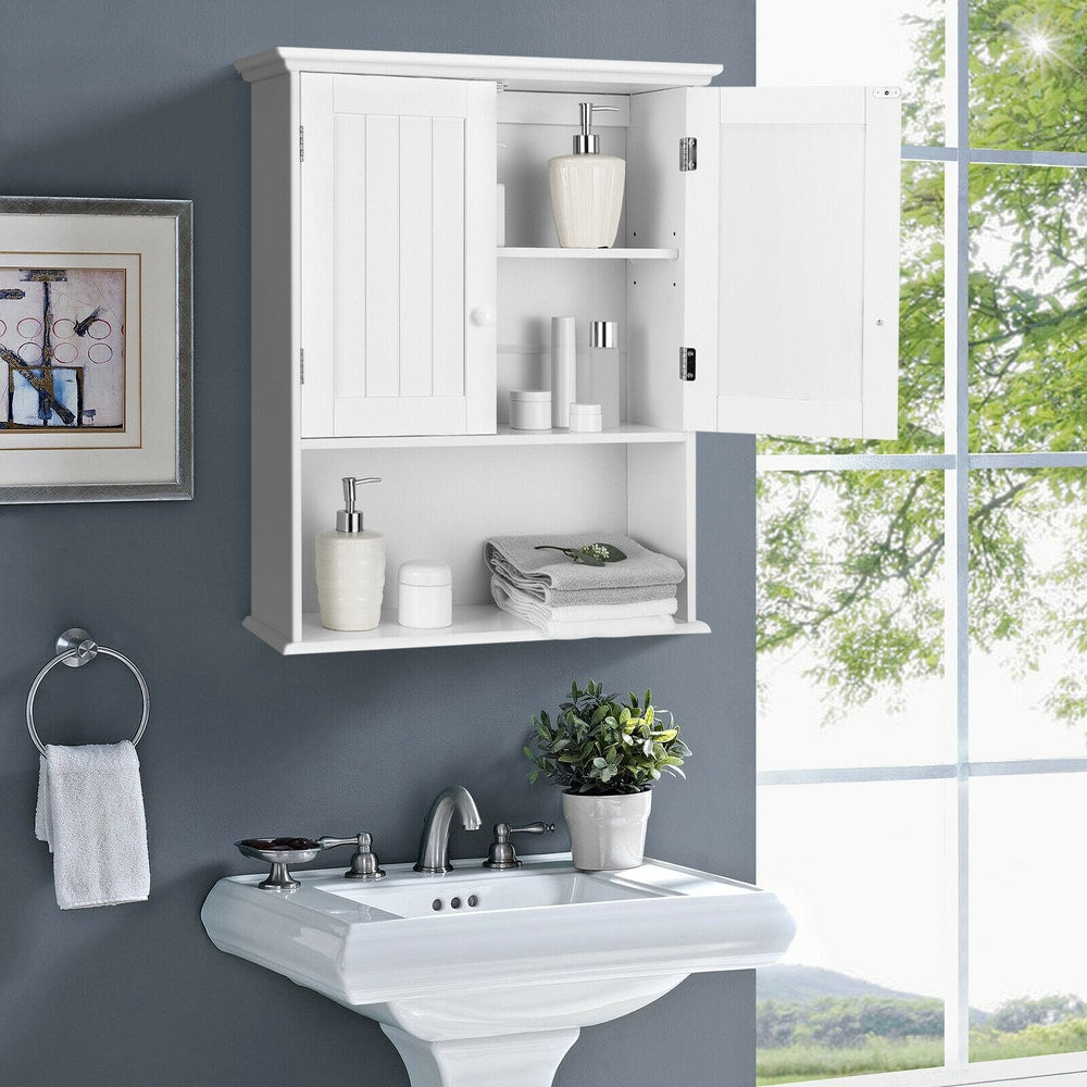 The wall cabinet with one door open, displaying toiletries on shelves