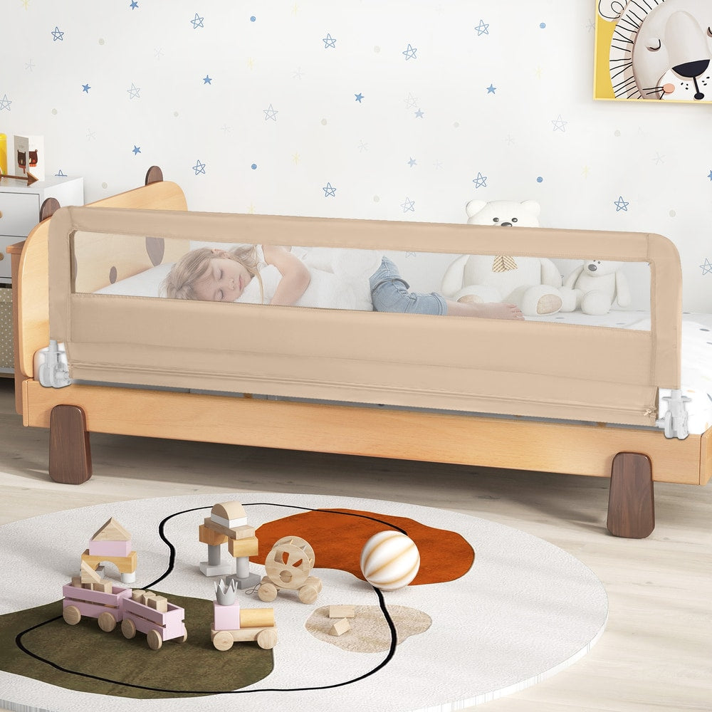 The beige bed rail guard fitted to a child's wooden bed with toys