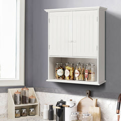 White wall cabinet filled with jars and containers, on a kitchen counter