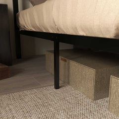 Close up of the bed legs and under bed storage boxes