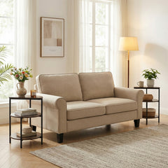 Two rustic brown 3-tier round side tables flanking a beige sofa in a living room