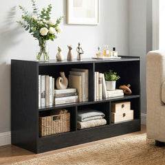 The black kids bookcase filled with books and decorative items
