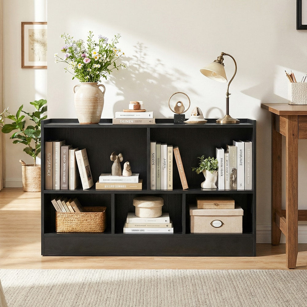 The wooden kids bookcase in a bright room with books and decor