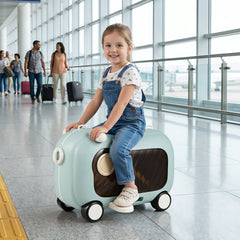 The kids luggage being ridden by a young girl in an airport terminal