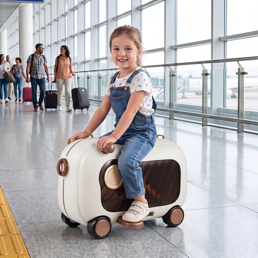 A young girl rides on the brown kids luggage in an airport terminal