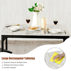 The white dining table has a large rectangular tabletop with a marble effect finish