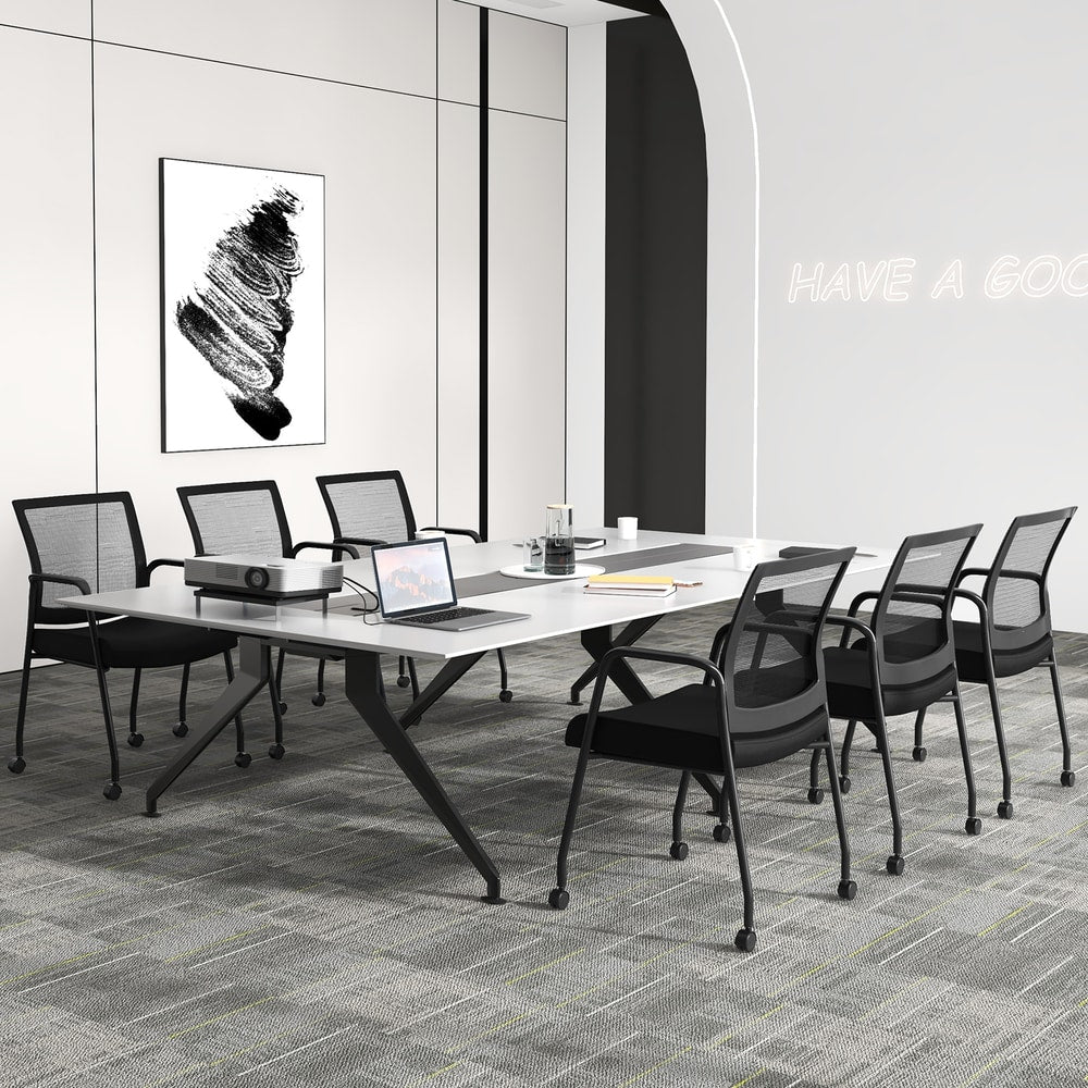 The office chairs positioned around a long conference table in a professional office