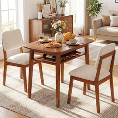 The dining room set with food and drinks on the table, set in a cosy room