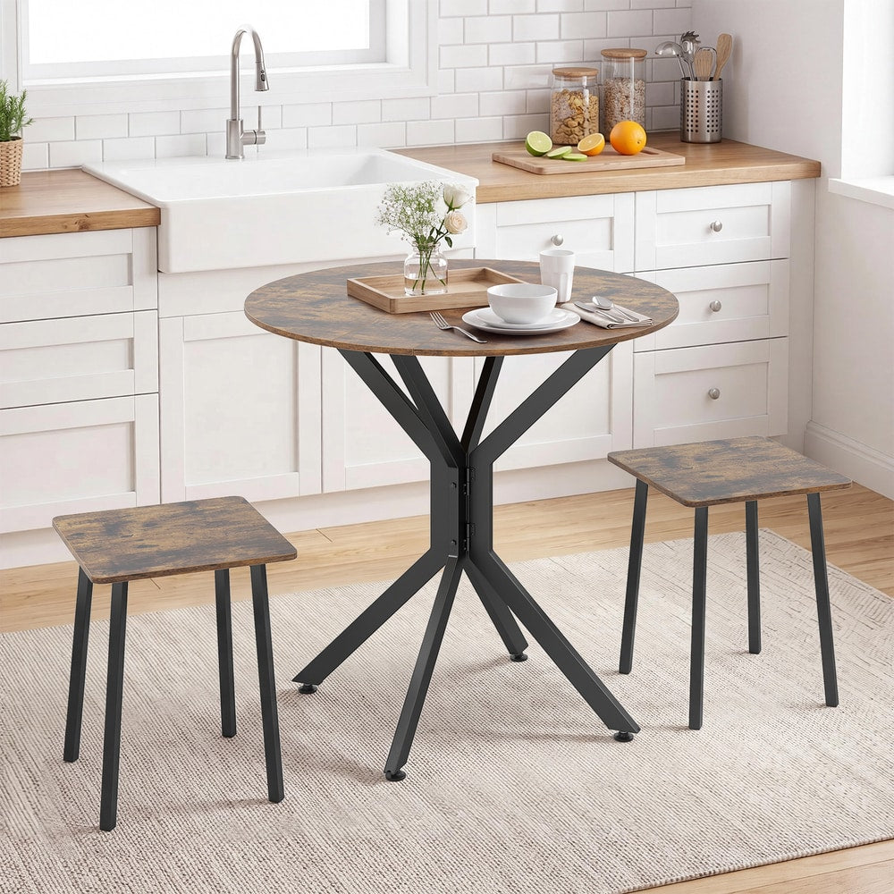 The dining room set placed in a bright kitchen with white cabinets and a farmhouse style sink