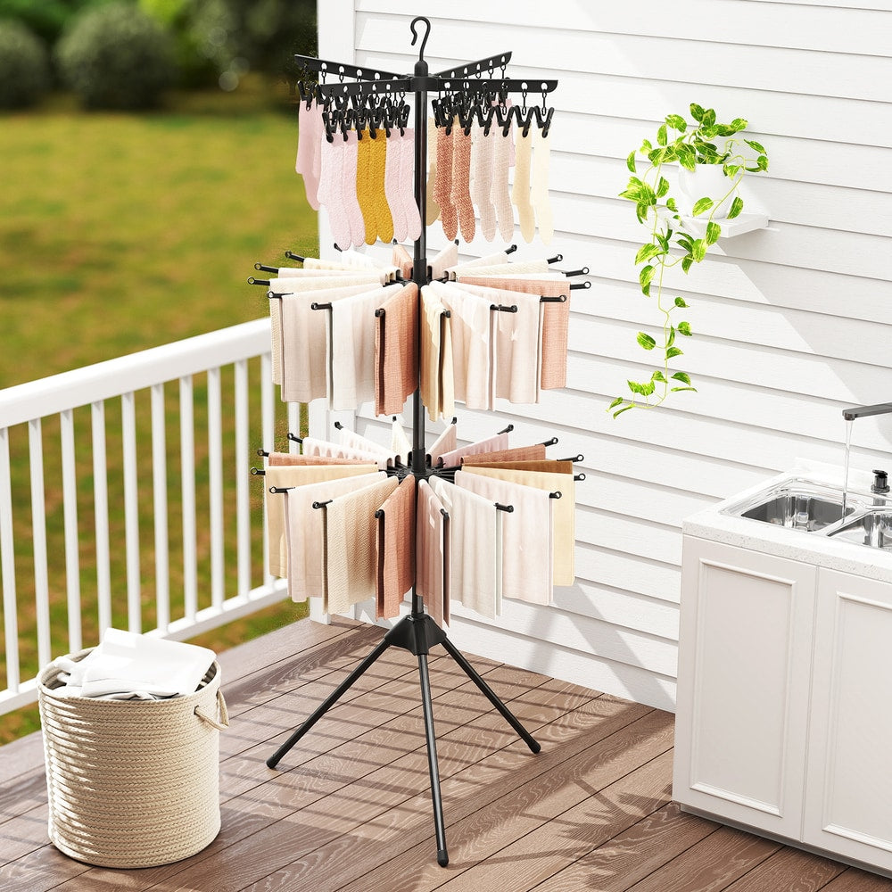 The laundry drying rack with clothes drying on a patio or balcony