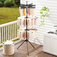 The laundry drying rack with clothes drying on a patio or balcony
