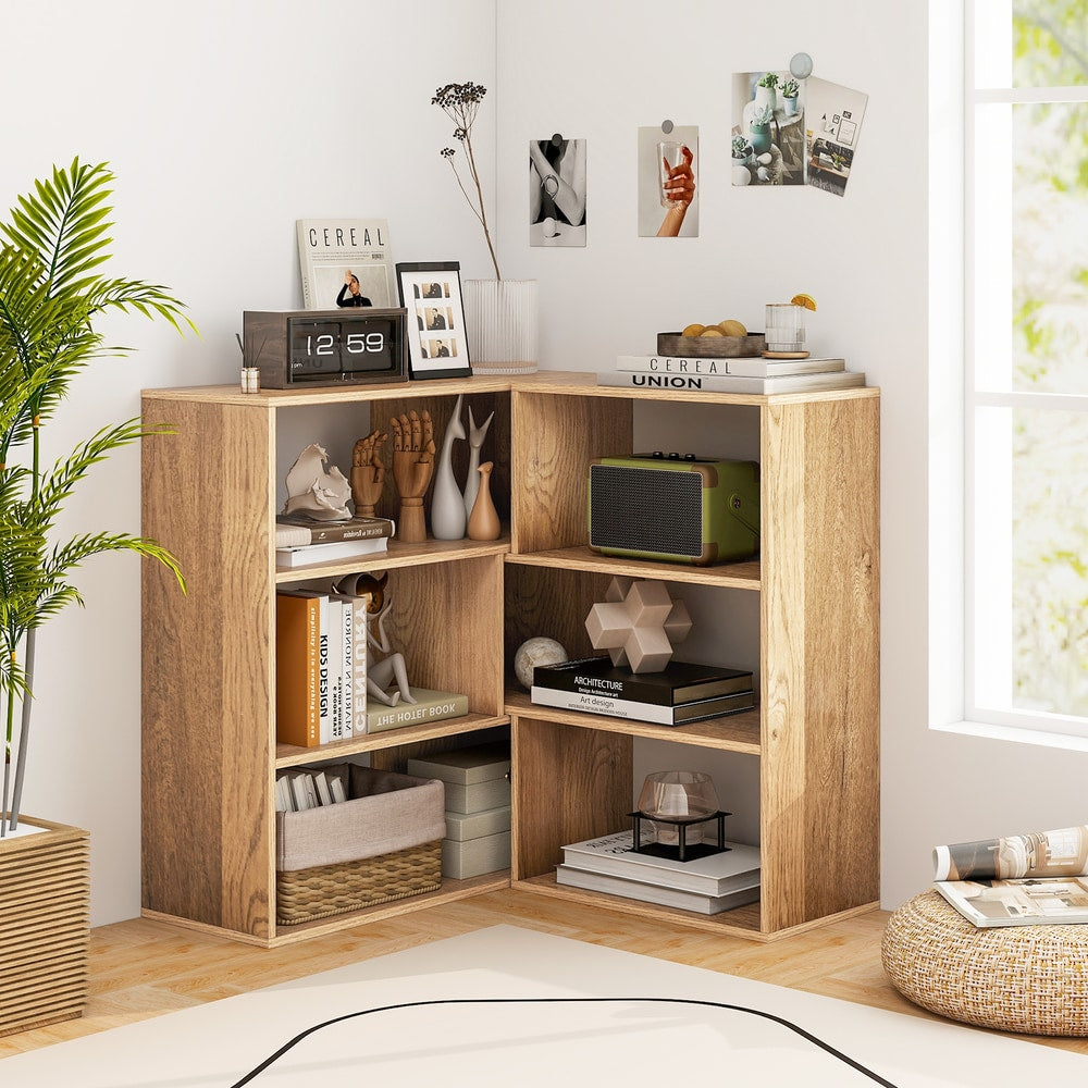 The corner bookcase is filled with books and decorative items in a bright room setting