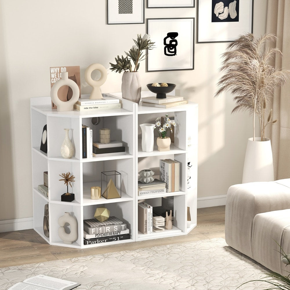 Two white corner cabinets placed side by side against a wall with various home decor objects