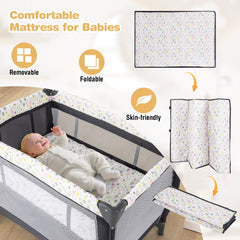 The baby playard with a baby lying on the removable and foldable patterned mattress