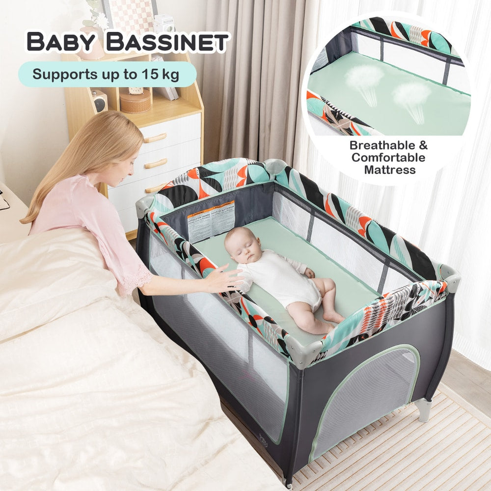 The baby playpen used as a bassinet with a baby sleeping inside next to a parent