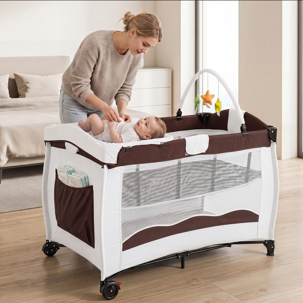 A mother places her baby on the changing table of the baby playpen