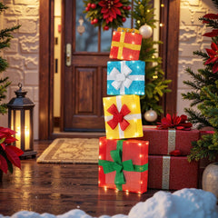 The illuminated gift boxes stacked as a tower on a porch floor