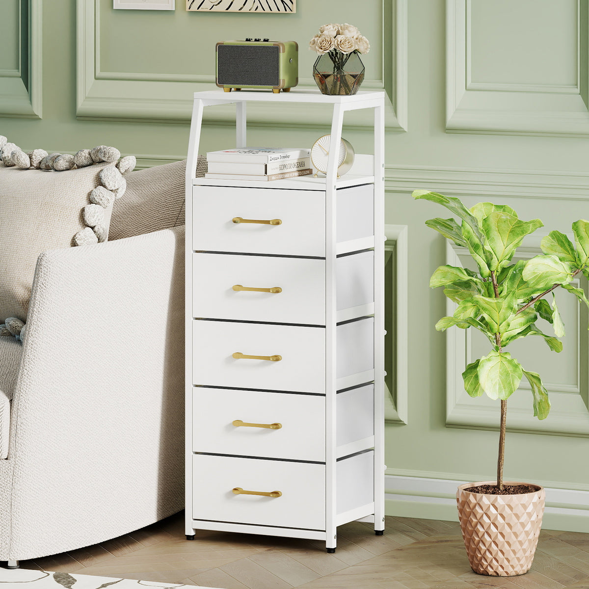 The storage cabinet placed in a living room next to a sofa and a potted plant