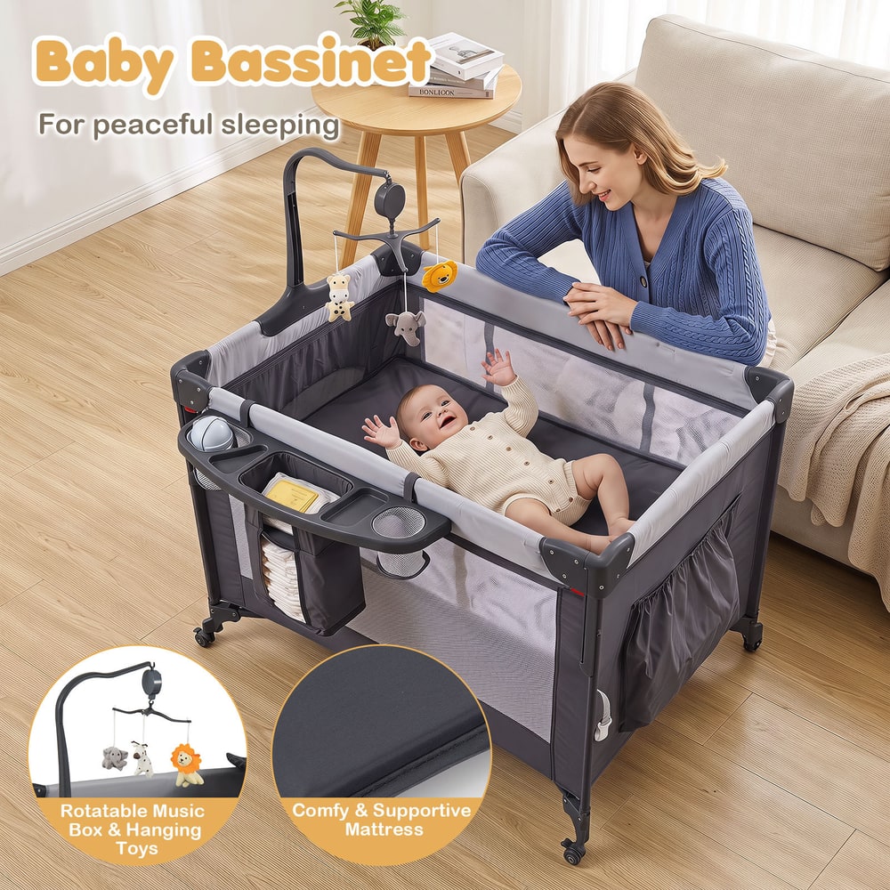 The bedside sleeper with a baby inside and close-ups of the mattress and toy mobile