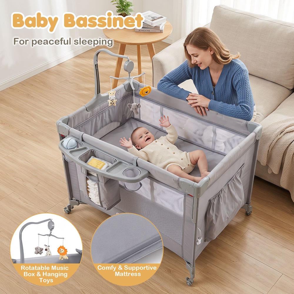 The infant bedside sleeper with a baby resting inside the bassinet