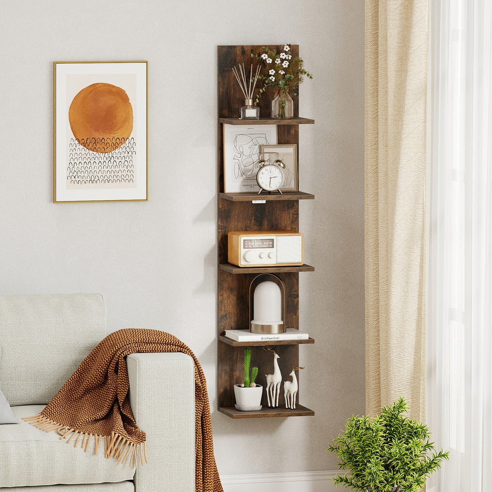 A single rustic brown wall shelf is shown in a room with a sofa and plant