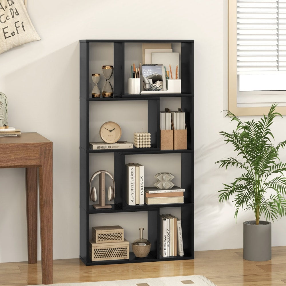The black open display unit styled with books and office accessories in a home study area