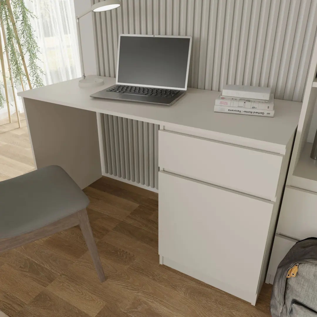 The white desk with a laptop and lamp on top in a modern home office