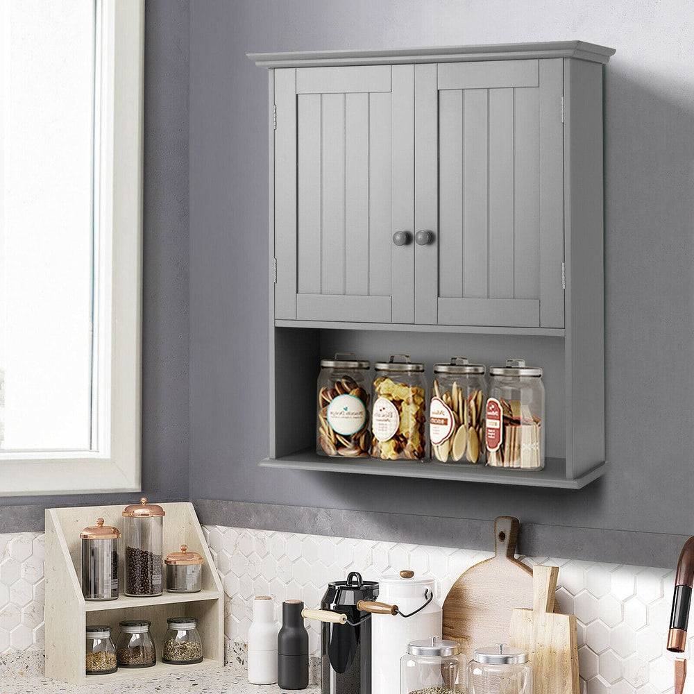 Grey wall cabinet with adjustable shelf in a kitchen, holding jars of food