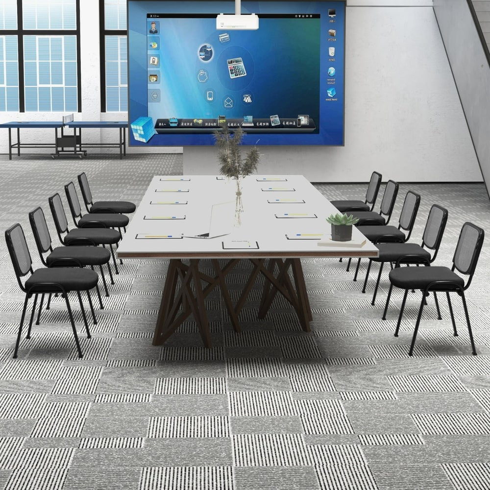 The office chairs arranged in rows around a large conference table in a professional setting