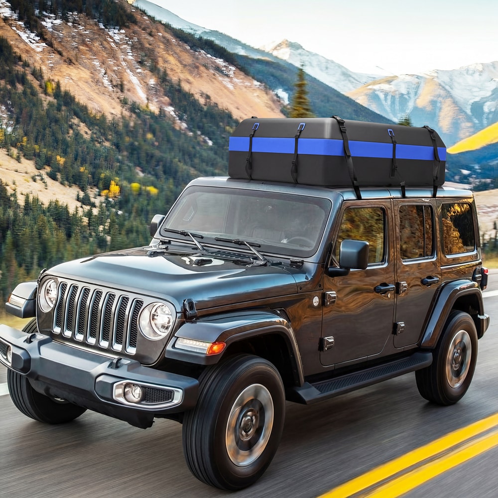 The waterproof rooftop cargo carrier bag is attached to the roof of a car driving on a mountain road