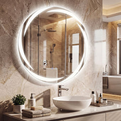The round LED bathroom mirror illuminated above a sink and vanity unit