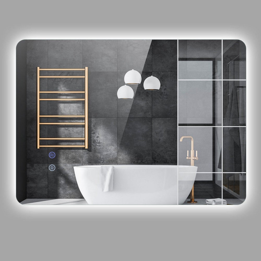 The illuminated rectangle mirror in a stylish bathroom with a white bathtub and gold tap