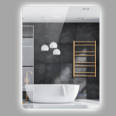 A rectangular wall mounted mirror with integrated lighting, shown in a bathroom setting with a bathtub and towel rack