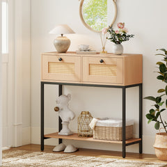 The console table styled in a hallway with a lamp, flowers, and a decorative bust