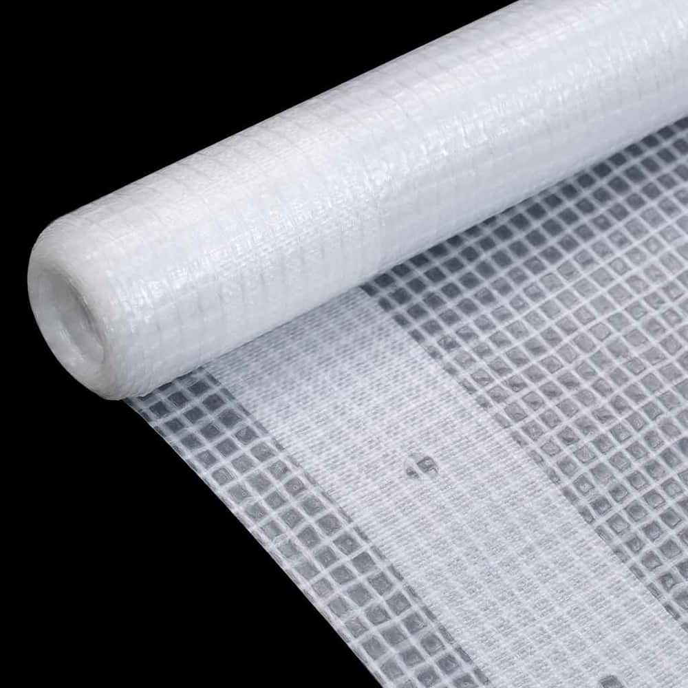 Close-up of a white tarpaulin material on a roll