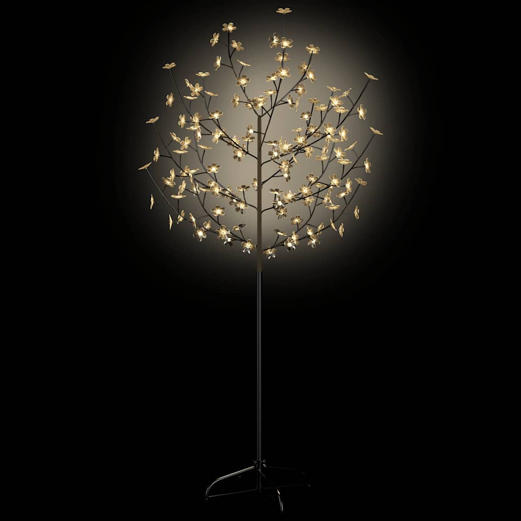The cherry blossom Christmas tree with warm white lights illuminated against a dark background