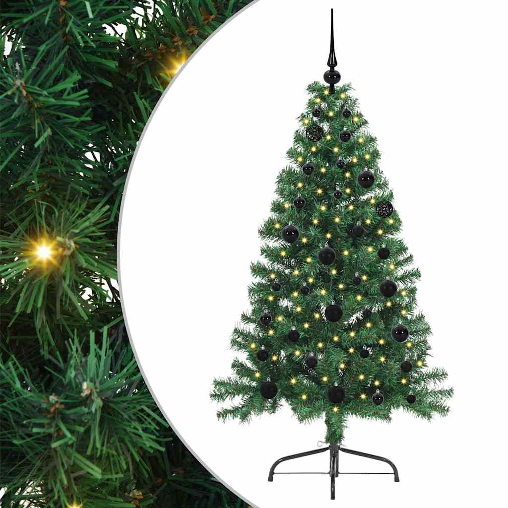 Close up of the green artificial Christmas tree branches with lights and baubles