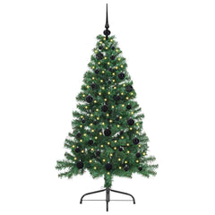 The green artificial Christmas tree with black baubles and lights, front view