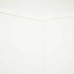 A corner detail of the white plant stand, showing the seamless joinery of the panels