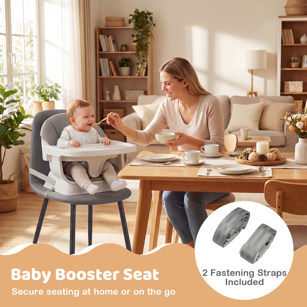 The grey baby booster seat is secured to a dining chair with fastening straps