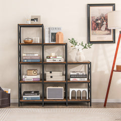 The bookcase styled with various books and ornaments next to a floor lamp