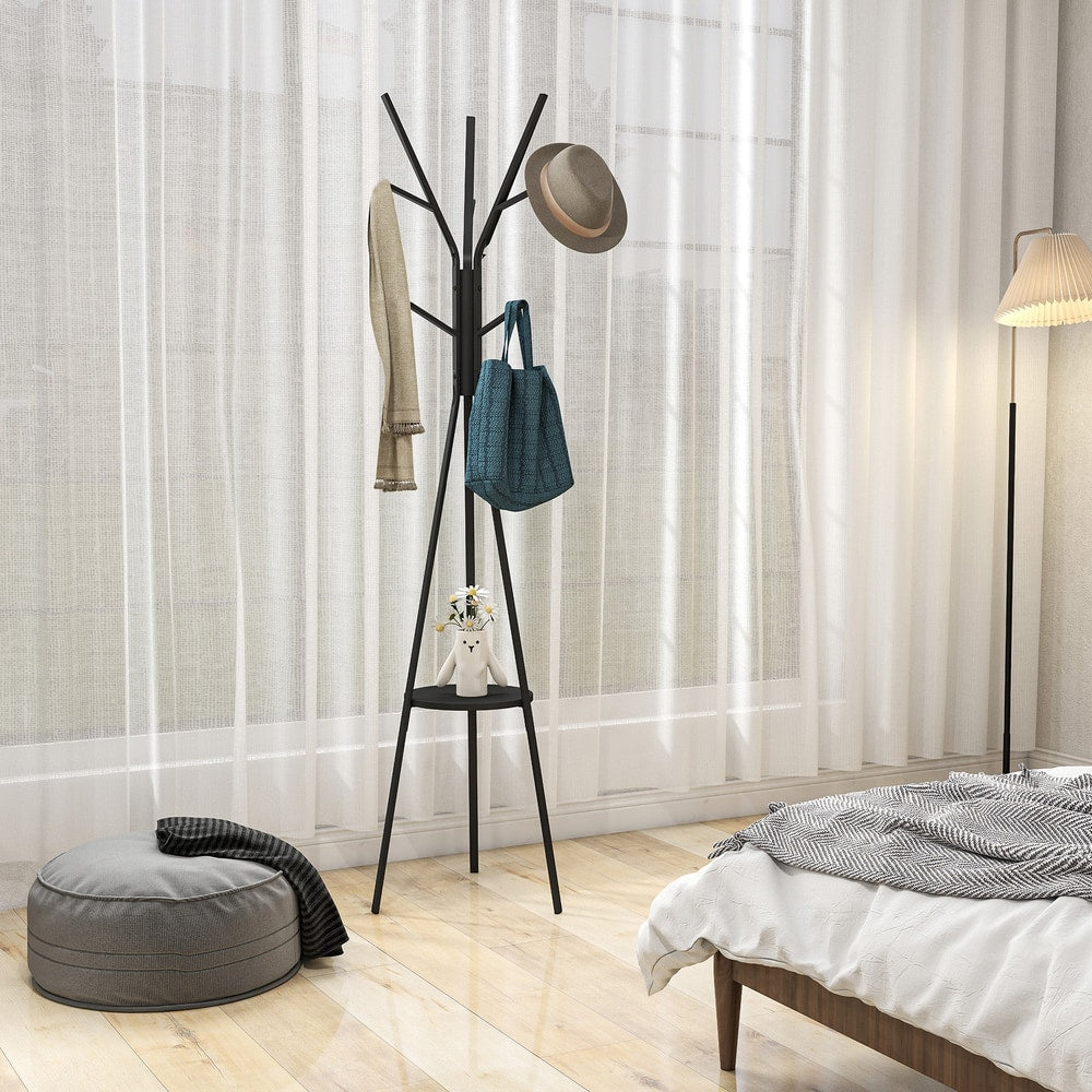 The coat stand holding a hat, a scarf and a bag in a bright bedroom next to a floor lamp