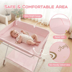 Close up of the pink changing table showing raised edges and a baby height gauge
